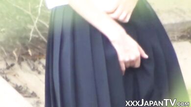 Voyeur cam catches Japanese schoolgirl secretly masturbating outdoors